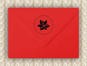 Single Poinsettia Holiday Personalized Self-inking Round Return Address Stamp on Envelope