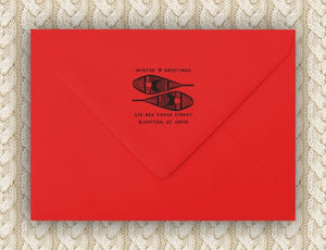 Snowshoes Holiday Personalized Self-inking Round Return Address Stamp on red envelope